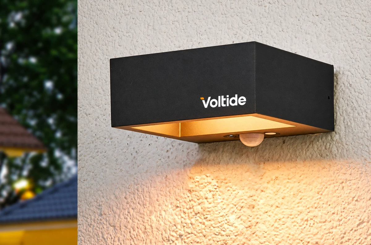 Voltide fictional identity study: wall-mounted brand application. AI-assisted concept, not client work.